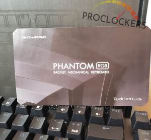 Phantom RGB 87 Keyboard manual in front of Phantom RGB packaging above keyboard